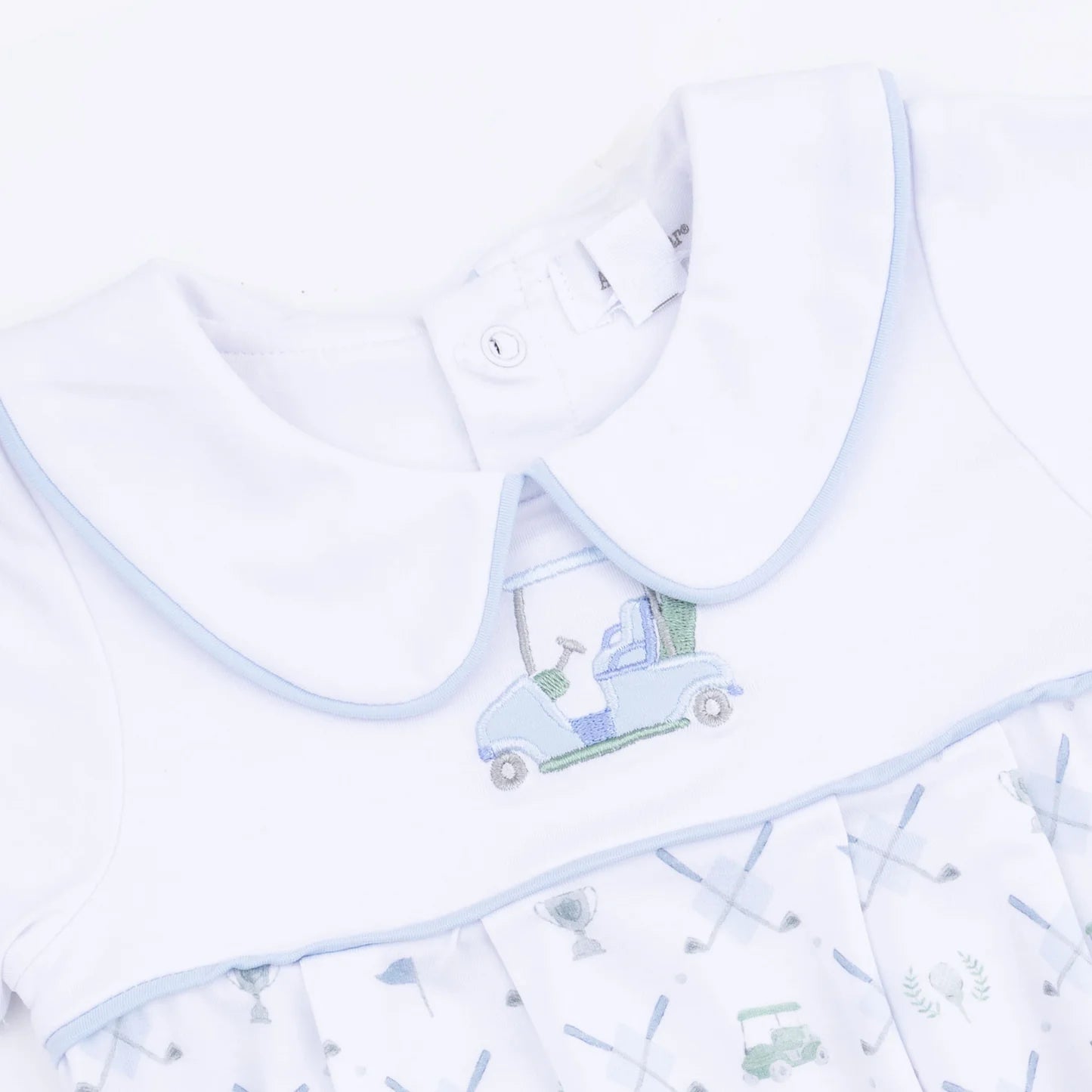 A close up of an Angel Dear Golf Trellis Blue Classic Box Pleat romper with a light blue embroiderd golf cart car design on a white background