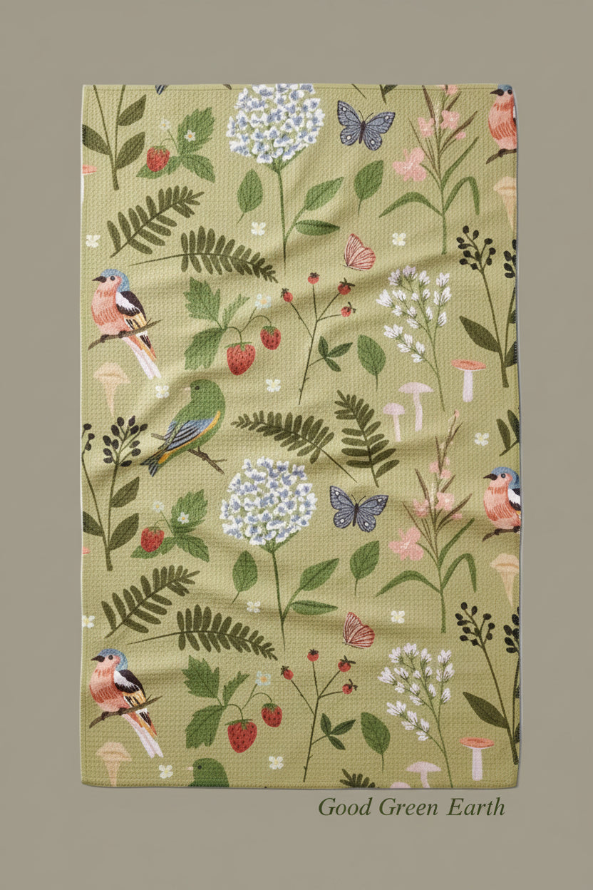 Geometry good green earth tea towel with Floral and bird patterned fabric on a white background