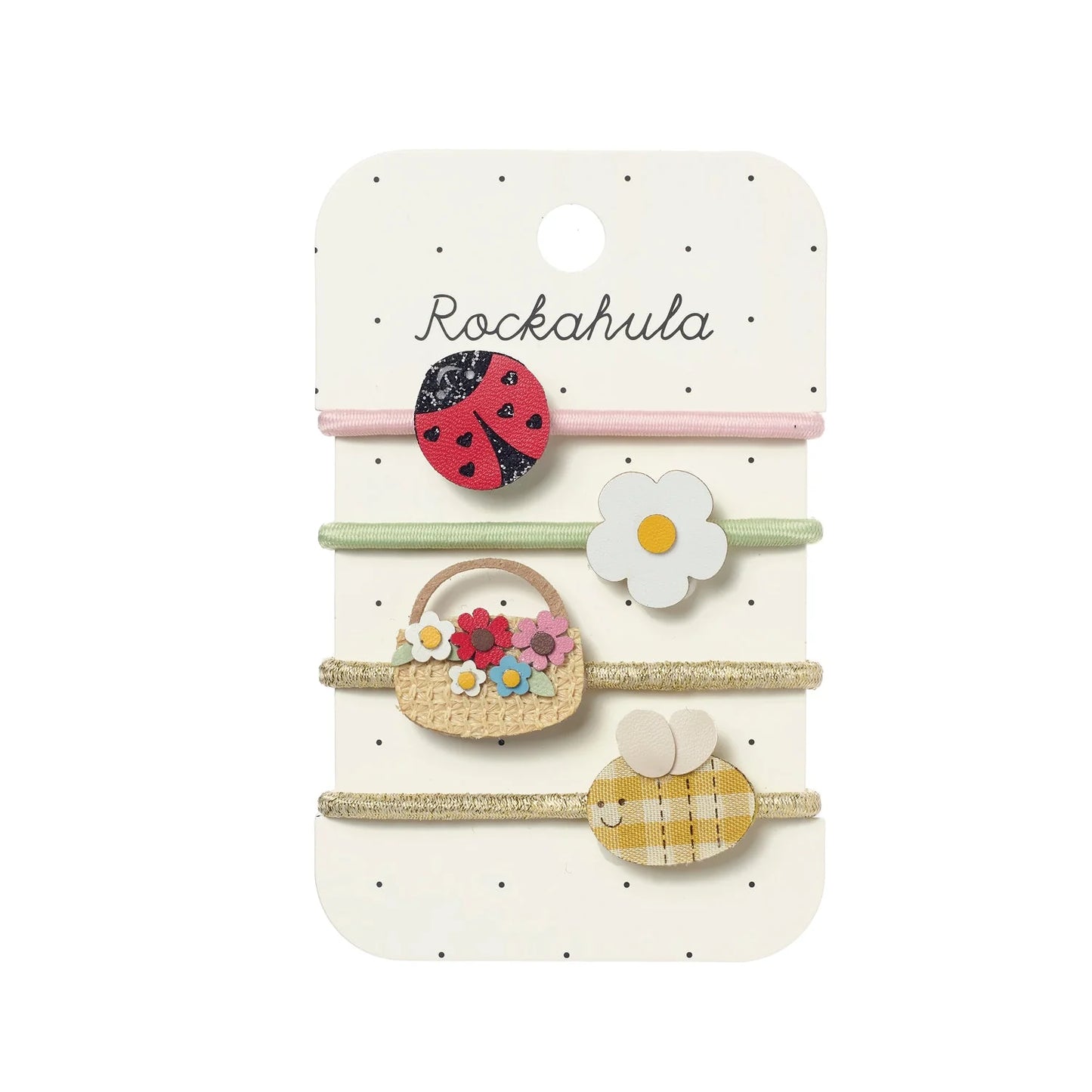 Set of hair ties with ladybug, flower, bee and basket designs on a Rockahula branded card.