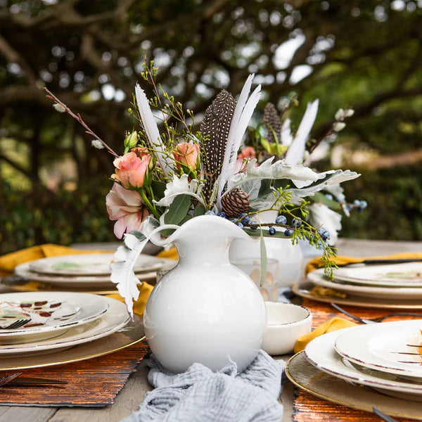 white Vietri hibiscus fluted vase with a floral arrangement
