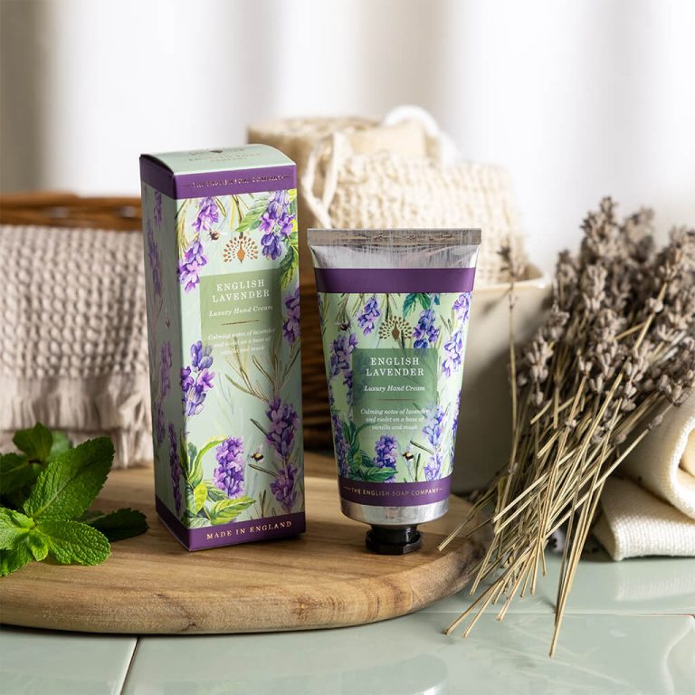 english lavender Hand cream and packaging with lavender design on a wooden board by the english soap company