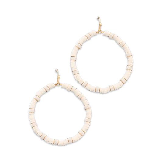 Pair of white rubber hoop earrings by Pierce & Hide on a white background
