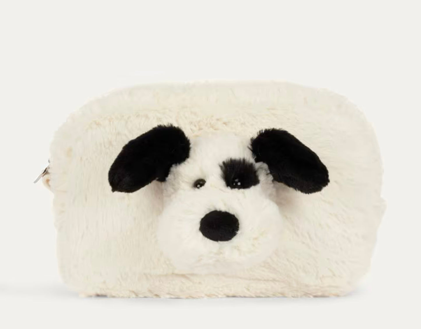 A fluffy cream-colored pouch or bag shaped like a dog face, featuring black ears, nose, and eyes, photographed on a clean white background.