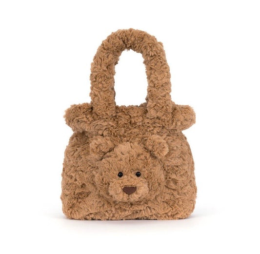 A brown teddy bear-shaped handbag with a curly, plush texture and a single top handle, photographed on a clean white background.