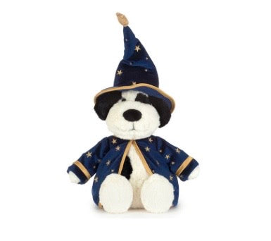 A plush puppy dressed as a wizard, wearing a navy blue pointed hat and matching robe with gold trim and star patterns, set against a plain white background.