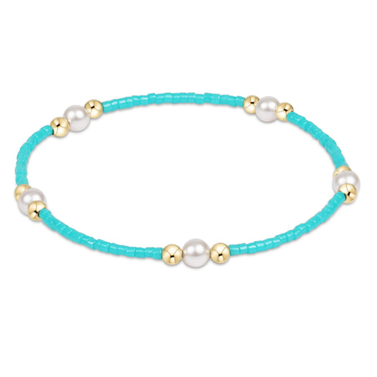 enewton hope purpose Turquoise beaded bracelet with pearls and gold accents on a white background