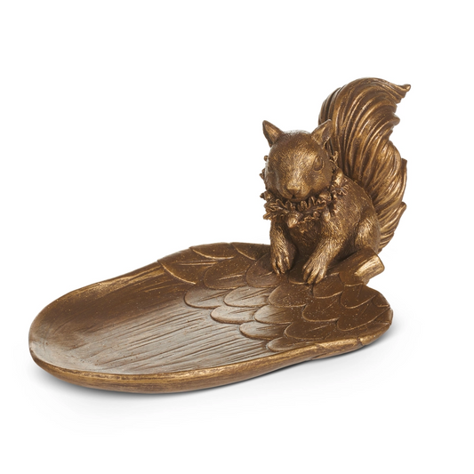 Bronze squirrel figurine on a leaf-shaped base against a white background