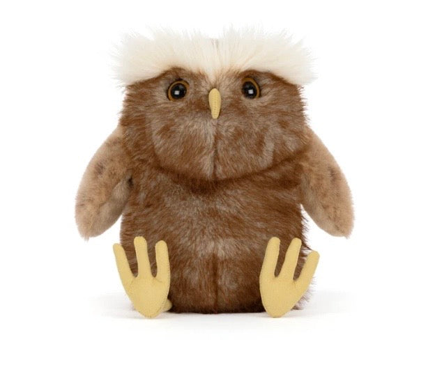 A brown plush owl toy with a fluffy white crest on its head, large dark eyes, a small yellow beak, and yellow feet, photographed against a plain white background.