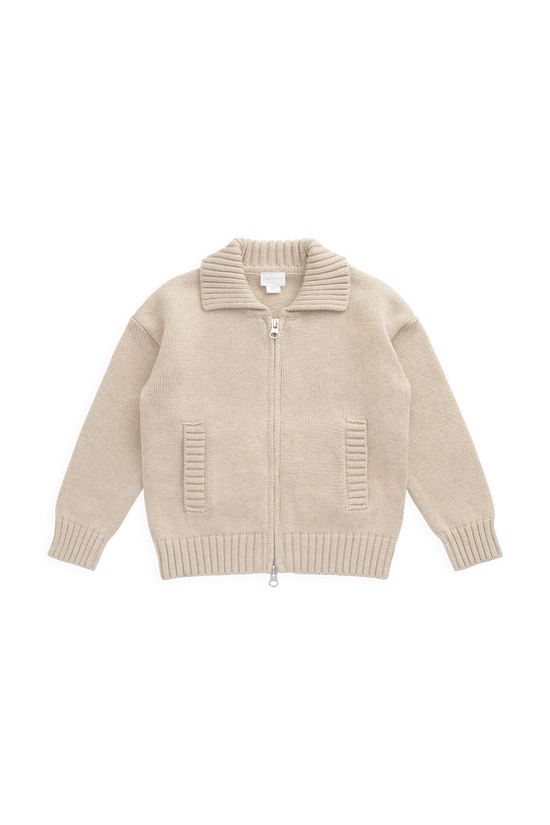 A beige knit zip-up cardigan sweater with a ribbed collar, cuffs, and hem, featuring two vertical ribbed pockets on the front, displayed flat against a solid white background.
