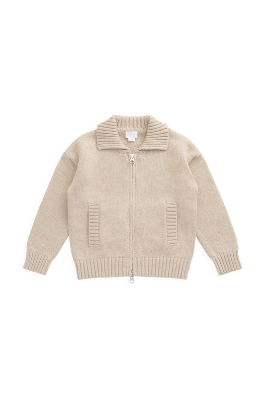 A beige knit zip-up cardigan sweater with a ribbed collar, cuffs, and hem, featuring two vertical ribbed pockets on the front, displayed flat against a solid white background.