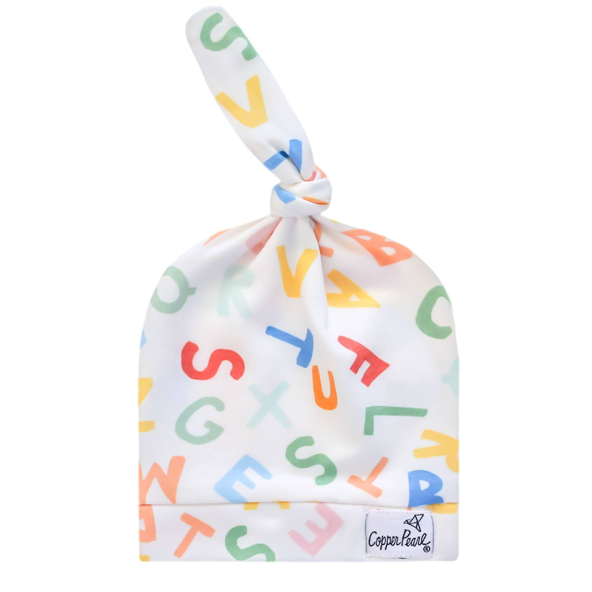 Cooper Pearl Baby top knot hat in Webster pattern with a white hat and colorful  capital alphabet letters in red, blue, green orange, salmon, yellow and teal.