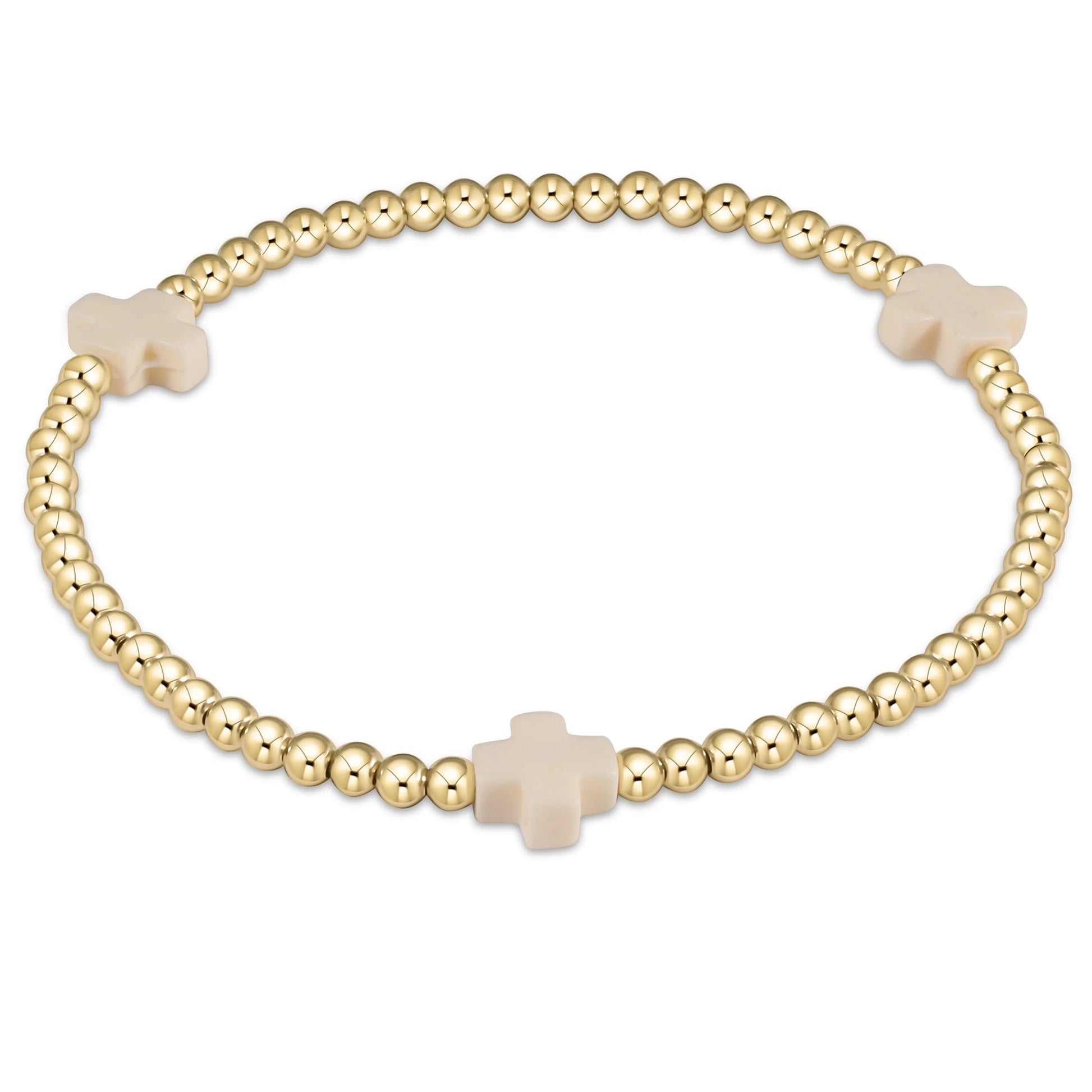 An enewton signature cross gold-colored bracelet with off-white beads and a cross pattern, designed for women.