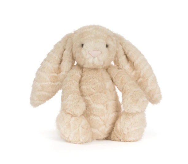 A plush stuffed bunny toy in a soft cream-beige color with long floppy ears, small black embroidered eyes, and a tiny pink stitched nose, photographed on a clean white background.
