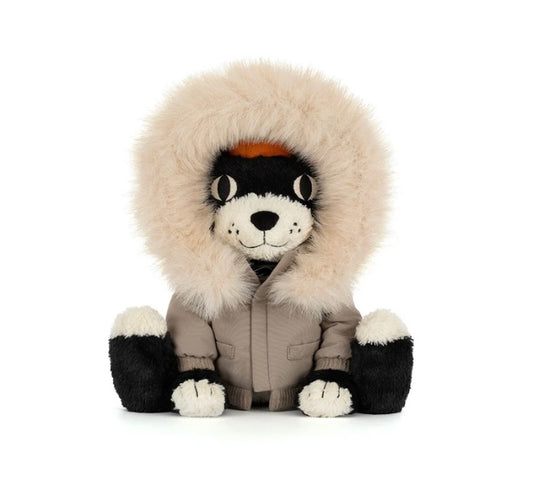A plush stuffed animal styled like a polar bear wearing a beige parka and a large cream-colored fur hood, set against a plain white background.