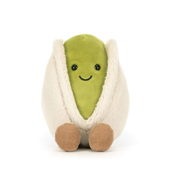 Plush toy shaped like a pistachio on a white background