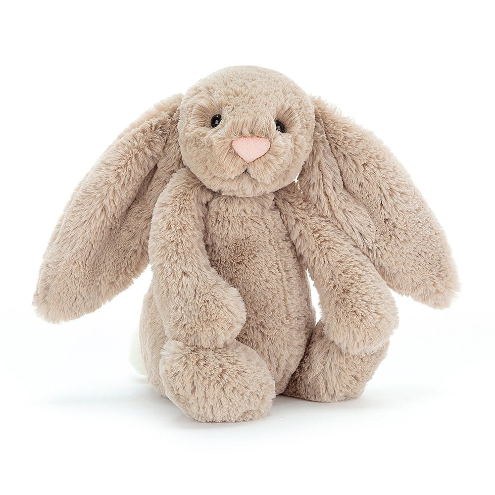 A beige plush toy rabbit with long ears and a pink nose.