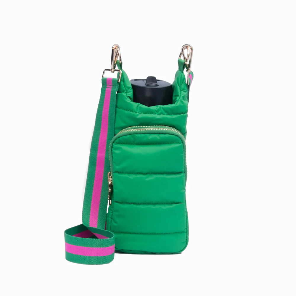A kelly green matte water bottle bag with a pink strap and gold hardware. The bag is shown with a water bottle inserted into it.