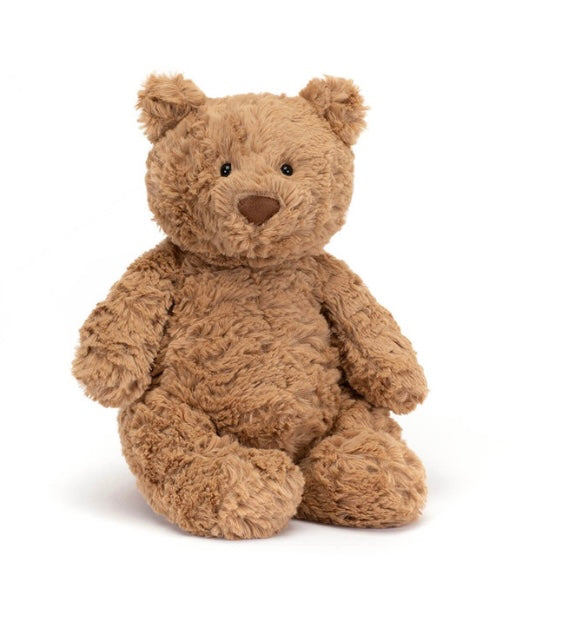 Brown teddy bear on a white background