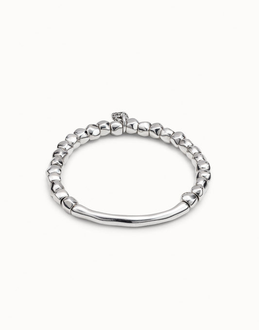 An UNOde50  silver beaded bracelet with a tube-shaped silver-plated metal piece, handmade.