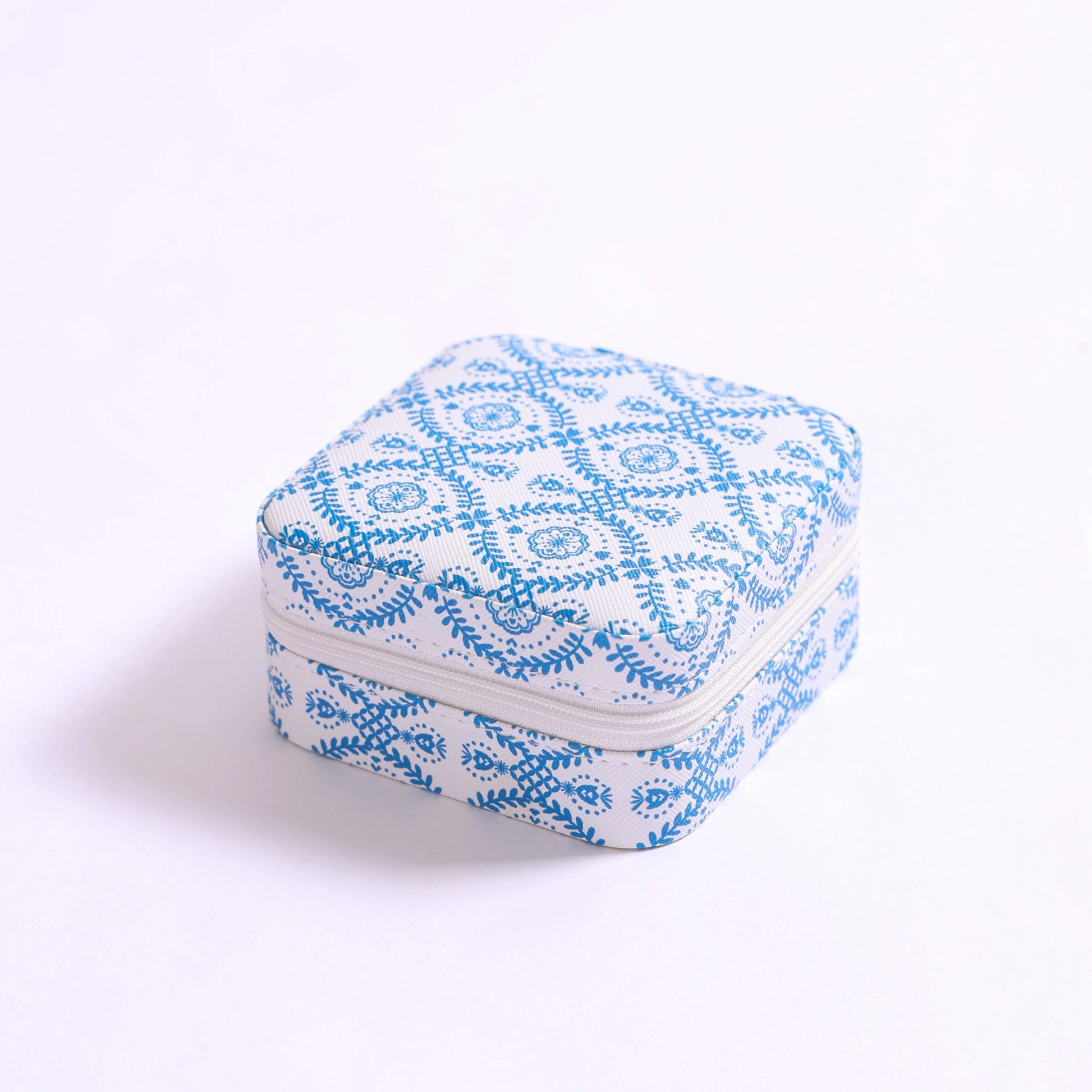 small square jewelry box with blue pattern on a white background