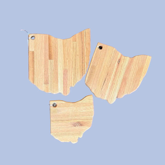 Three wooden cutting boards shaped like the state of Ohio 