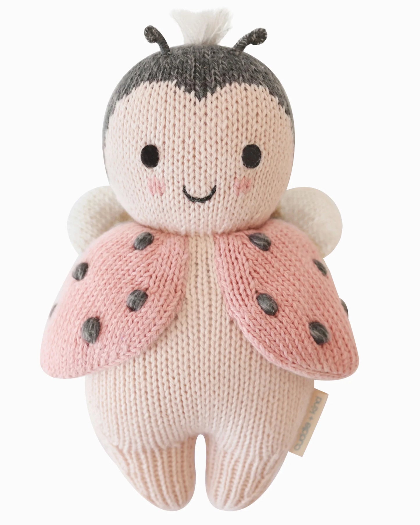 Knitted pink ladybug toy with antennae and spotted wings