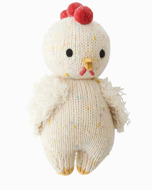 Knitted chicken toy with red comb on a white background