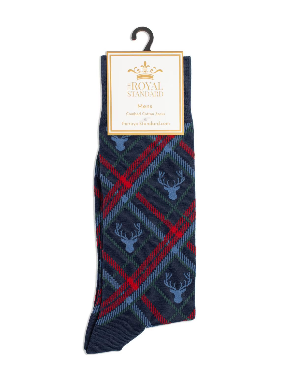 A pair of men's socks from The Royal Standard, featuring a navy blue base with red and blue tartan plaid and light blue deer motifs, hanging on a black hook with a branded paper label.
