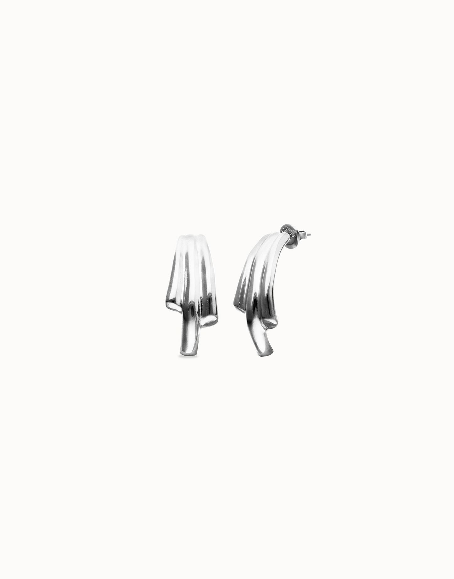 Pair of Roots silver UNO de 50 drop earrings on a white background