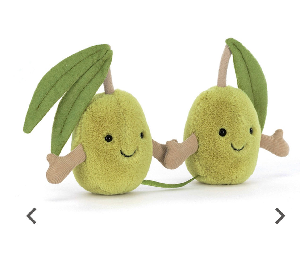 Two plush olives with smiling faces on a white background