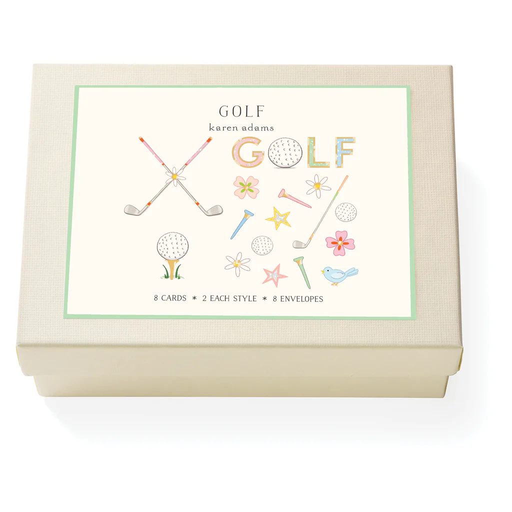 Box of golf-themed greeting cards with illustrations on a white background