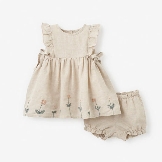 Beige baby dress with floral embroidery and matching bloomers on a white background