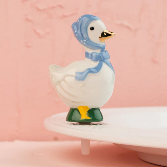 nora fleming mini duck with a blue bonnet 