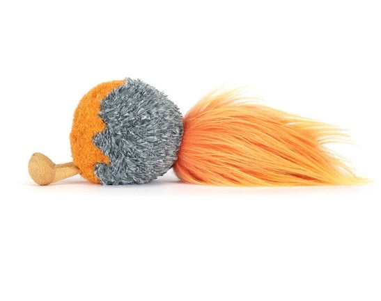 Toy with a wooden handle, gray and orange ball, and long orange tail on a white background