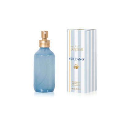 Blue spray bottle with gold cap and striped box labeled 'Volcano' on a white background