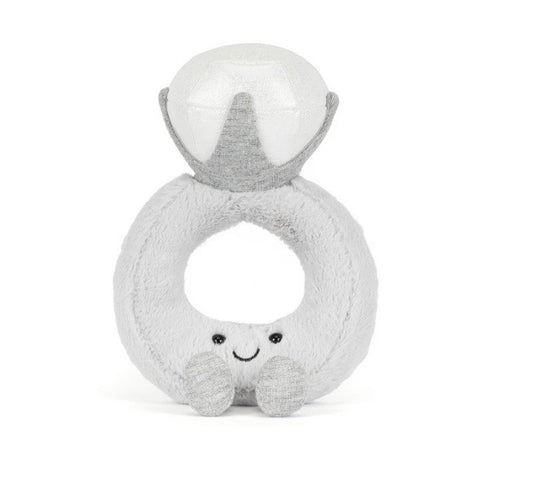 Plush toy with a round body and ring-like structure on a white background