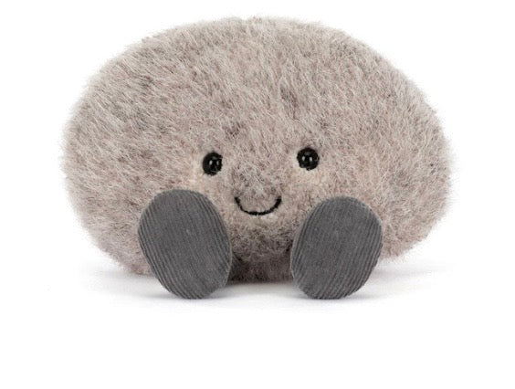 Plush toy resembling a mole on a white background