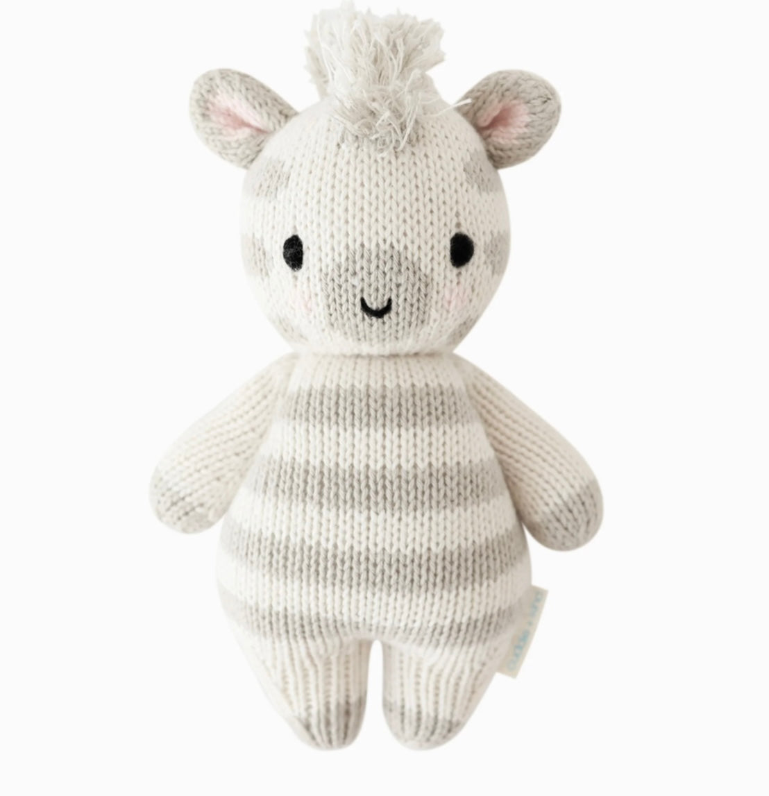 Hand-knit white and gray striped baby zebra plush toy with a soft texture, safe for cuddling, made from sustainable materials.