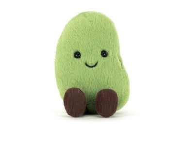 Plush avocado toy with a smiling face on a white background