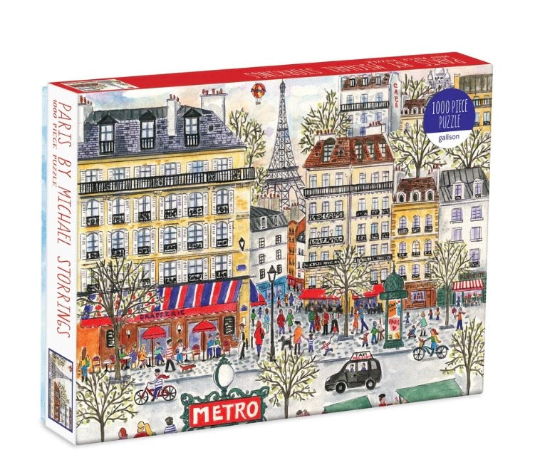 Jigsaw puzzle box with a colorful illustration of a Parisian street scene.