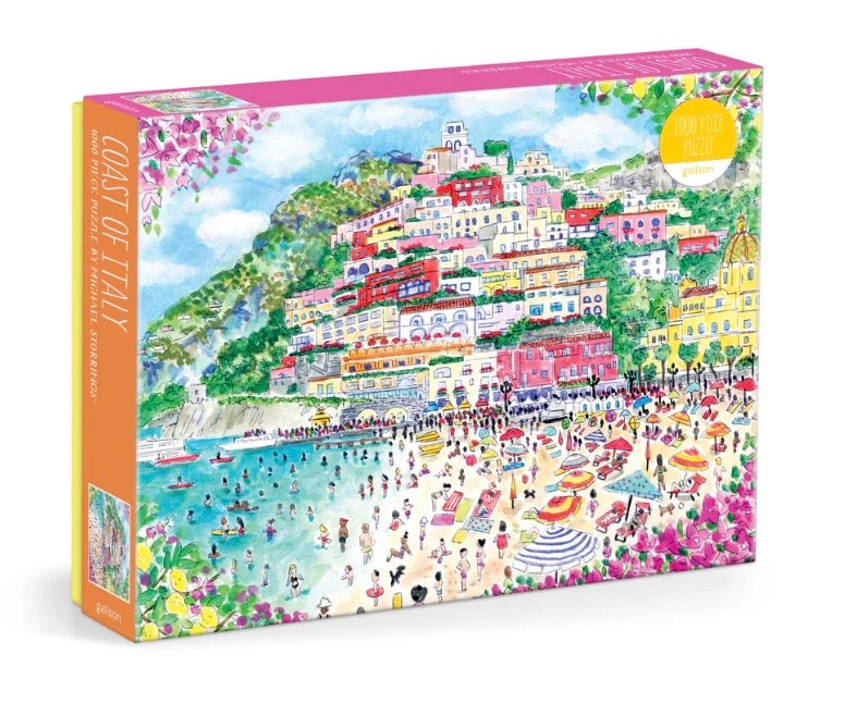 Jigsaw puzzle box with colorful illustration of a coastal town, likely in Italy.