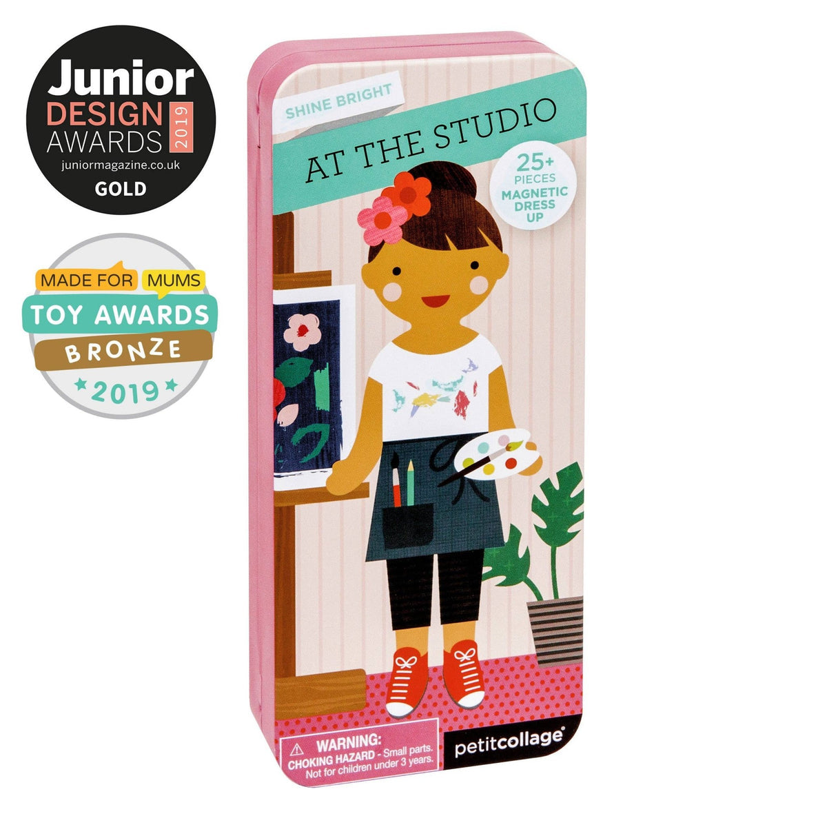 Box of 'At the Studio' magnetic dress-up set by Petitcollage with awards on a white background
