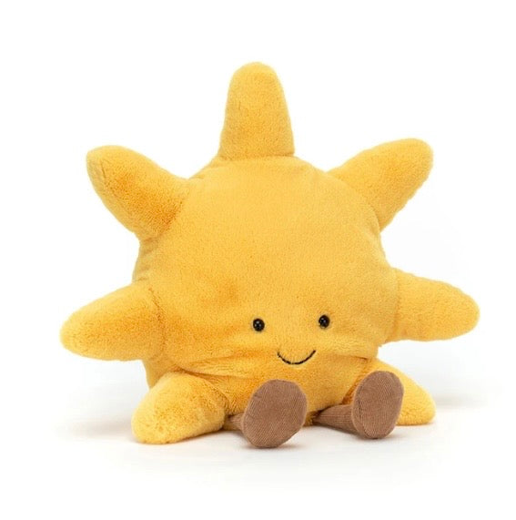 Plush sun toy with a smiling face on a white background