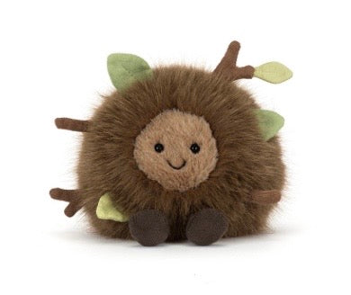 Plush toy hedgehog with leaf accents on a white background