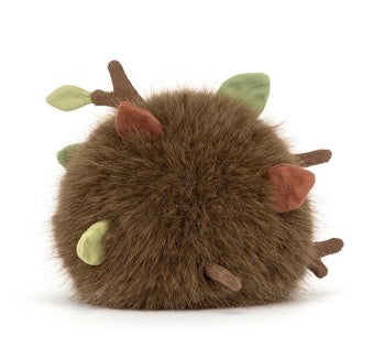 Small plush toy hedgehog with antlers on a white background