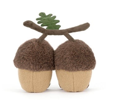 Toy acorns with antlers on a white background
