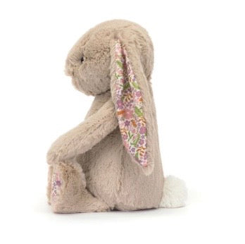 Floral-patterned bunny plush toy on a white background