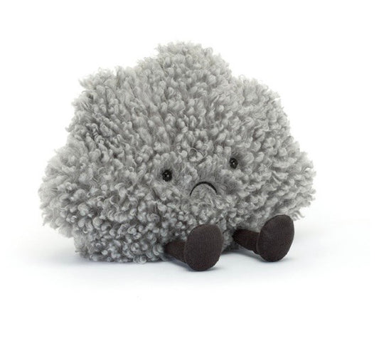 Plush toy hedgehog with a sad expression on a white background