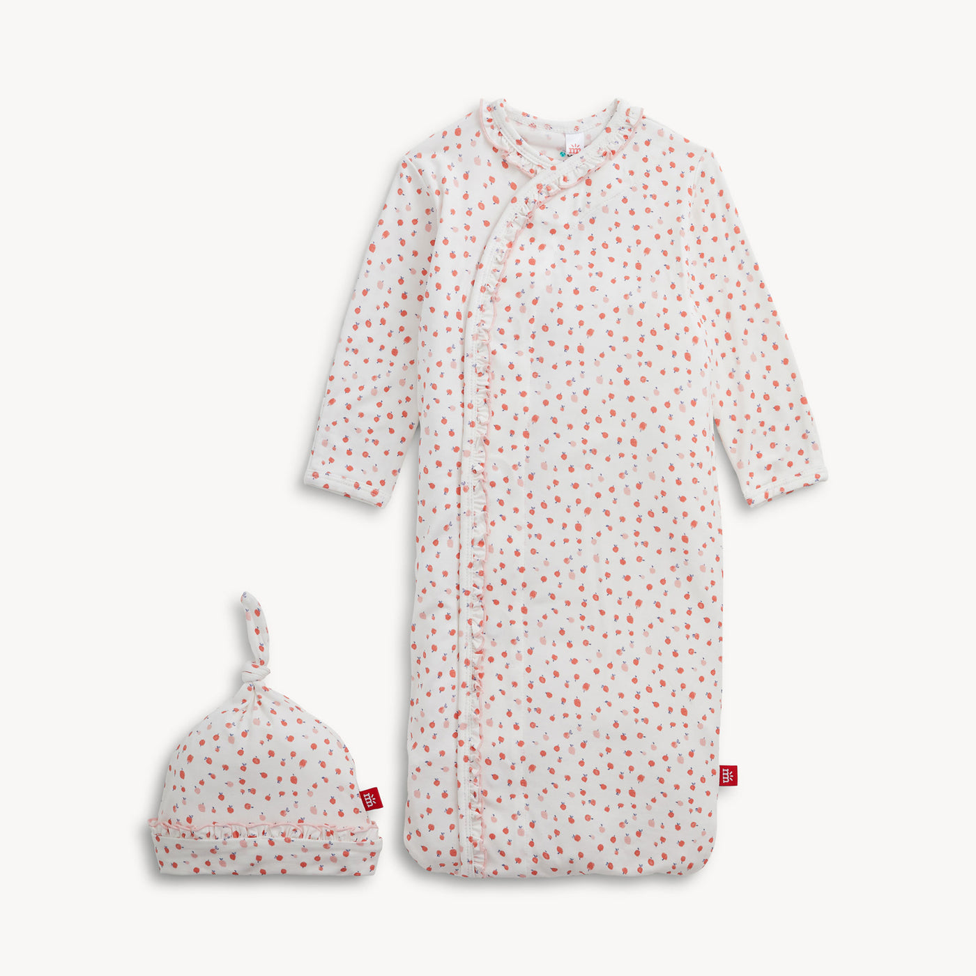 Apple blossoms on ruffled gown with hat
