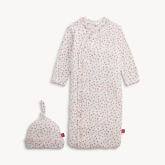 Apple blossoms on ruffled gown with hat